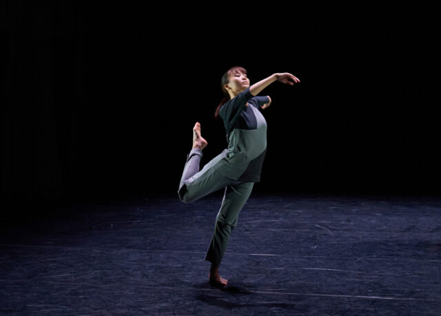 Graceful Contemporary Dance Performance in Minimalist Dark Stage Background Wallpaper