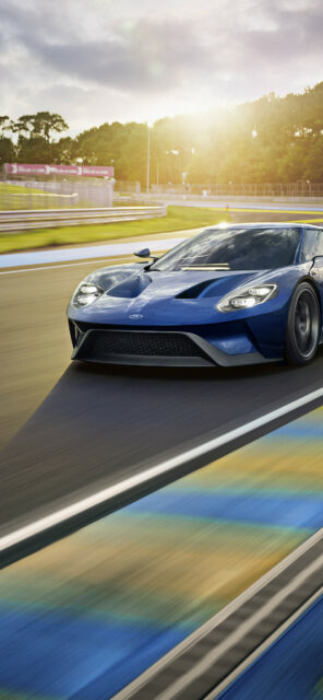 Gran Turismo 7 Wallpaper High Speed Blue Sports Car Racing On Track