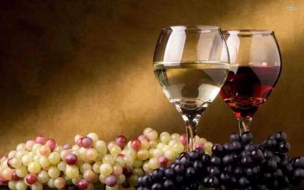 Two glasses of wine with grapes arranged on a surface, HD Desktop Wallpaper