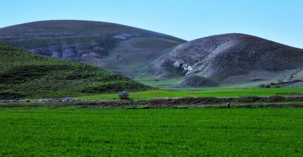 The green hills and fields under a clear blue sky represent Algeria wallpapers nature, 4K Desktop Wallpaper