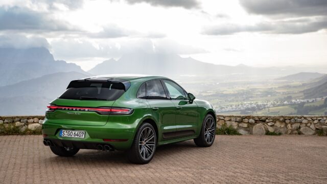 Green Porsche Macan Turbo parked with mountain and valley view Porsche Macan Wallpapers