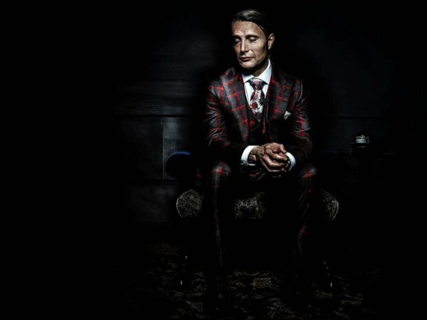 Hannibal Mads Mikkelsen sits in a dark room wearing a patterned suit, HD Desktop Wallpaper