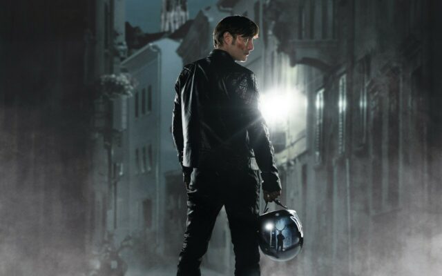 Hannibal TV Series Wallpaper Dark Mysterious Scene with Man Holding Helmet in Foggy Alley