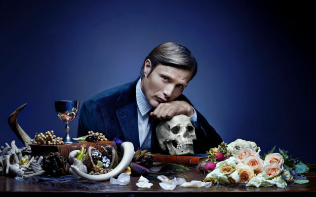 Hannibal TV Series Wallpaper Featuring Mads Mikkelsen with Skull and Dark Floral Arrangement