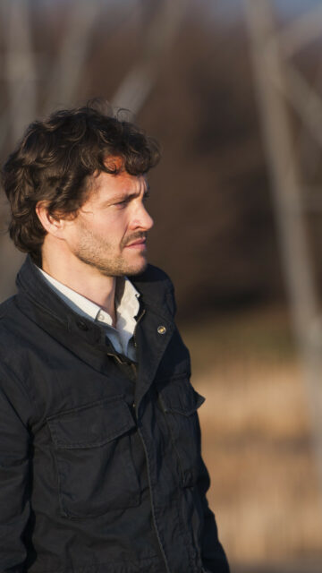 Hannibal TV Series Wallpaper Profile of Man in Dark Jacket Outdoors