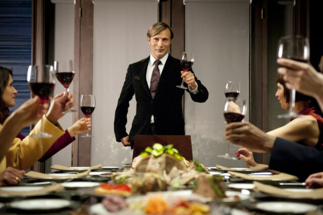 Hannibal TV Series Wallpaper Scene with Toast and Dinner Table Celebration