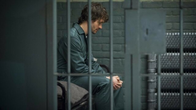 Hannibal TV Series Wallpaper Young Man Sitting in Prison Cell Reflective Mood