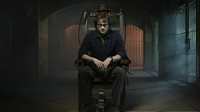 Hannibal TV Series Wallpaper featuring Suspenseful Scene with Captive Character in Dark Prison Room