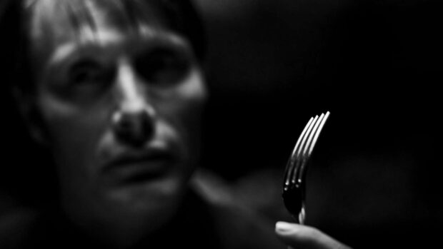 Hannibal Mads Mikkelsen wallpapers featuring a man holding a fork in a dim environment, HD PC Wallpaper