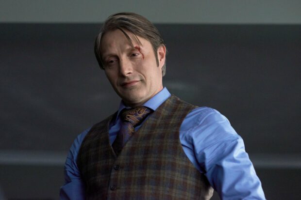 Hannibal Mads Mikkelsen displays a subtle smile with a minor injury on his forehead, 2K Desktop Wallpaper