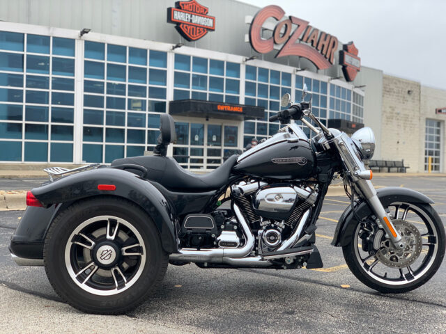 Harley Davidson Freewheeler Trike Parked In Front Of Dealership