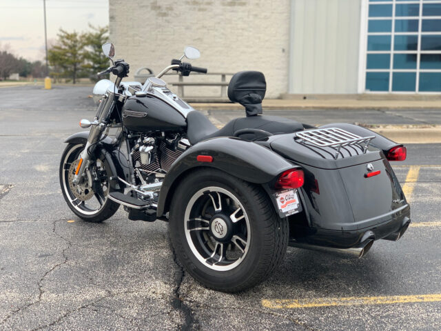 Harley Davidson Freewheeler Trike Parked On Asphalt Outdoors