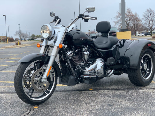 Harley Davidson Freewheeler Trike In Parking Lot Wallpaper