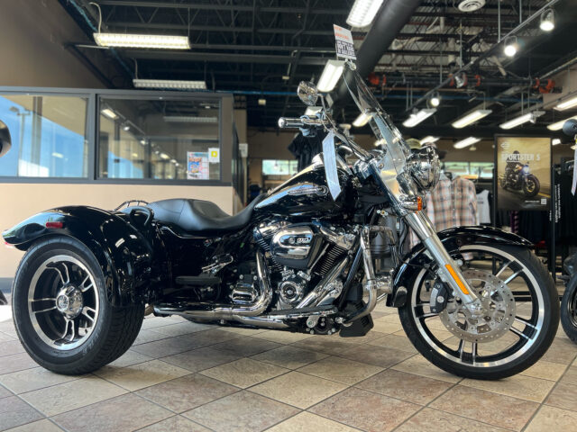 Harley Davidson Freewheeler Trike In Showroom Setting Wallpaper