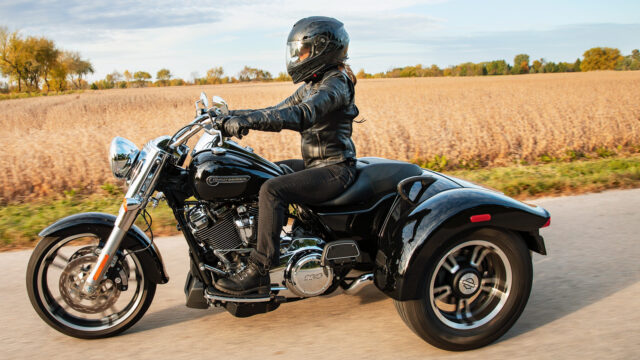 Harley Davidson Freewheeler Trike On Scenic Open Road Wallpaper