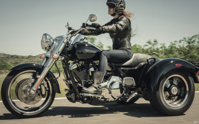 Harley Davidson Freewheeler Wallpaper With Rider On Open Road