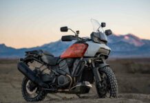 A Harley Davidson Pan America 1250 motorcycle is parked off road with mountains in the background, HD Desktop Wallpaper