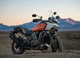 A Harley Davidson Pan America 1250 motorcycle is parked off road with mountains in the background, HD Desktop Wallpaper