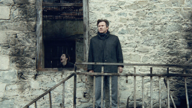 Harvey Keitel In A Dramatic Scene Stone Wall Background Wallpaper