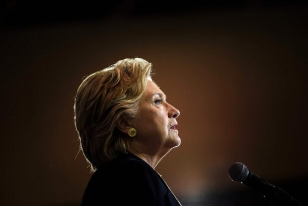 Hillary Clinton speaks at a public event with a microphone, HD Desktop Wallpaper