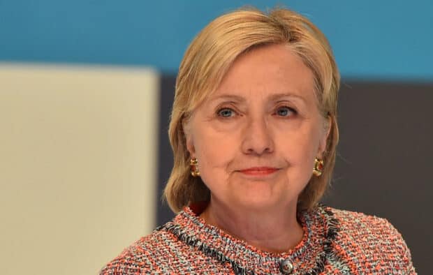 Hillary Clinton has a serious expression on her face with a colorful jacket, 2K Desktop Wallpaper