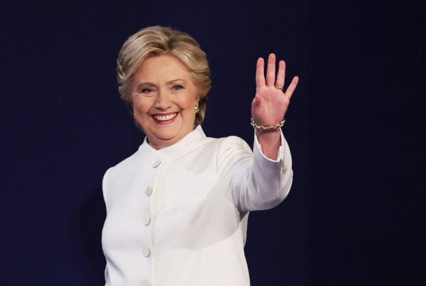 Hillary Clinton smiling and waving in a white outfit at an event, HD Desktop Wallpaper