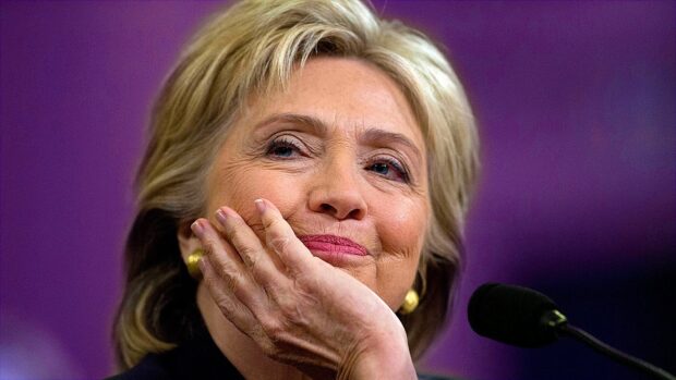 Hillary Clinton thoughtful expression with hand near face during speech, HD Desktop Wallpaper