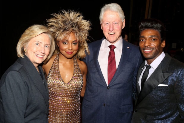 Hillary Clinton stands with three other people in formal attire at a social event, HD Desktop Wallpaper