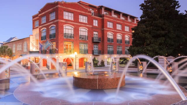 Historic South Carolina Fountain and Red Brick Building Urban Wallpaper