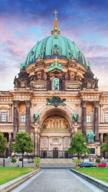 The cathedral stands prominently with its dome and sculptures under a vibrant sky, HD Mobile Wallpaper