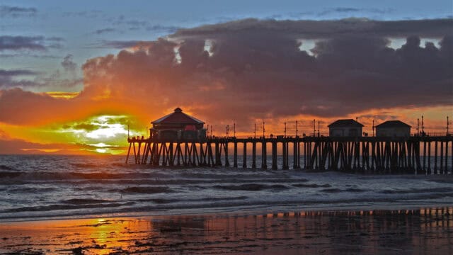 Huntington Beach Pier Sunset Vibrant Sky and Ocean Reflection Wallpaper