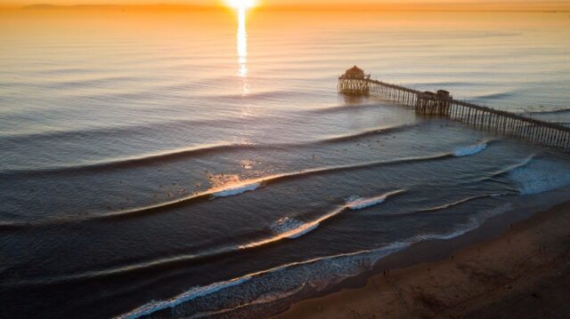 Huntington Beach Pier at Sunrise Stunning Ocean Waves Wallpaper