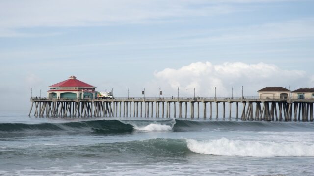 Huntington Beach Pier with Ocean Waves Clear Sky Scenic View Wallpaper
