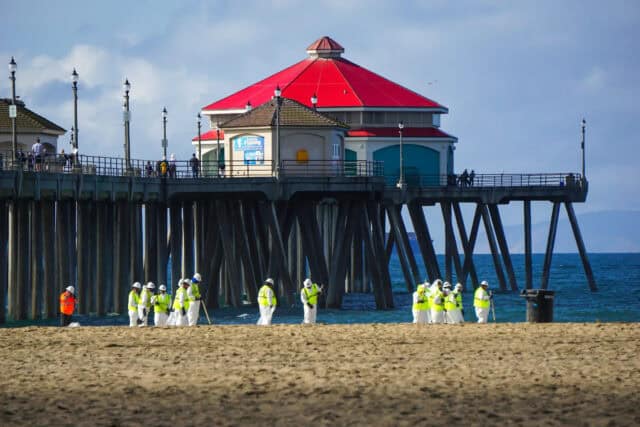 Huntington Beach Wallpapers Clean Up Crew Working Near Pier on Sunny Day