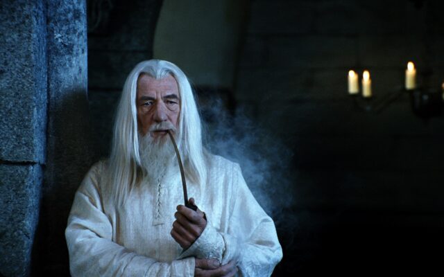 Ian McKellen As Gandalf Smoking Pipe In Lord Of The Rings Wallpaper