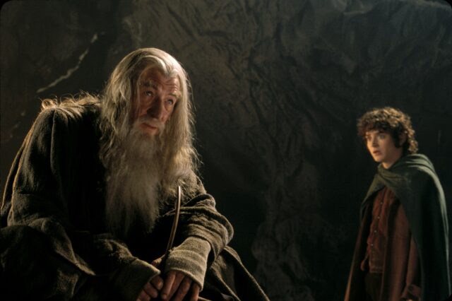 Ian McKellen As Gandalf With Frodo In Dark Cave Scene Lord Of The Rings Ian McKellen Wallpapers