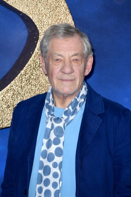 Ian Mckellen In Blue Jacket And Patterned Scarf Closeup Portrait Wallpaper