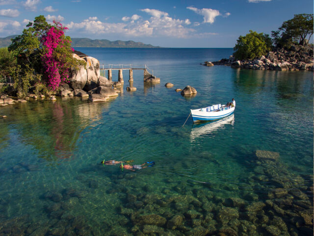 Idyllic Lake Malawi Scenery With Clear Waters And Boat