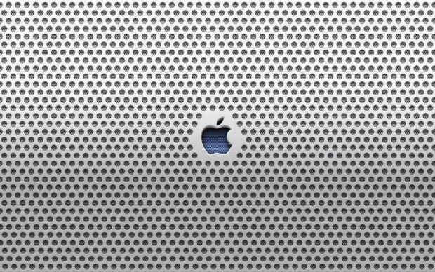 The imac logo is embedded in a close up metal grille surface showing texture and depth, 2K Desktop Wallpaper