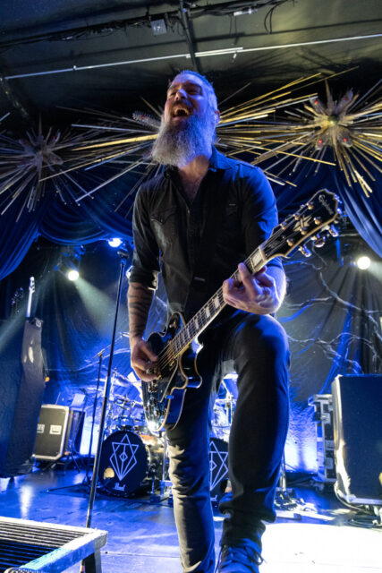 In Flames Band Performing Onstage With Electric Guitar