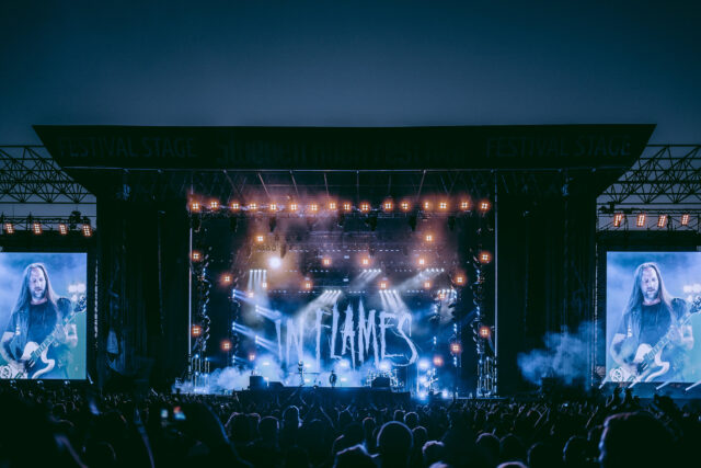 In Flames Live Performance Captured On Stage Wallpaper