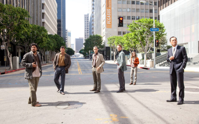 Inception Movie Cast On A City Street Scene Wallpaper