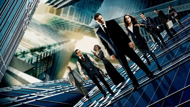 Inception Movie Team On Tilted Buildings Wallpaper