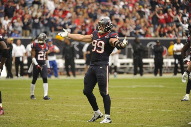 JJ Watt Celebrating On The Field NFL Action Wallpaper