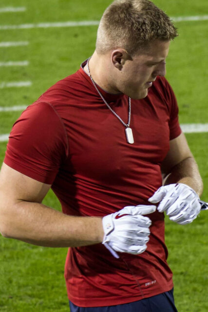 JJ Watt In Red Sports Gear On Field Wallpaper