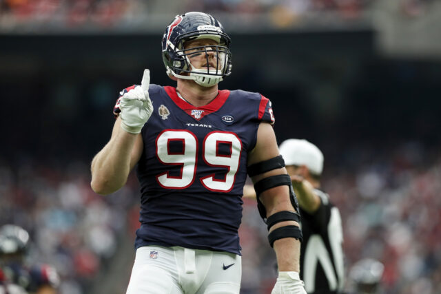 JJ Watt On Football Field In Action Wallpaper