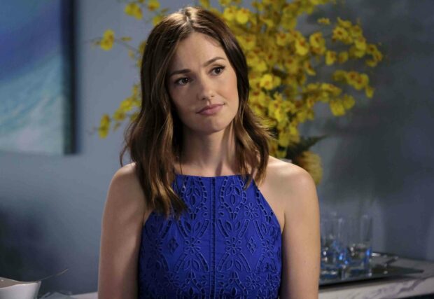 A woman in a blue dress stands thoughtfully with yellow flowers in the background featuring Jane The Virgin wallpapers, 2K Desktop Wallpaper