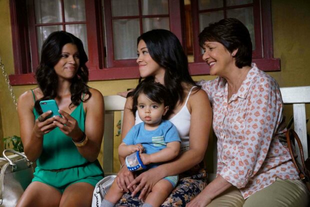 A family scene showing three women and a baby sharing a happy moment together from Jane The Virgin, 2K Desktop Wallpaper