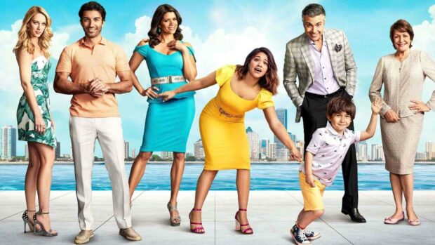 The main cast of Jane The Virgin is posing in colorful outfits by the waterfront with a city skyline in the background, HD Desktop Wallpaper