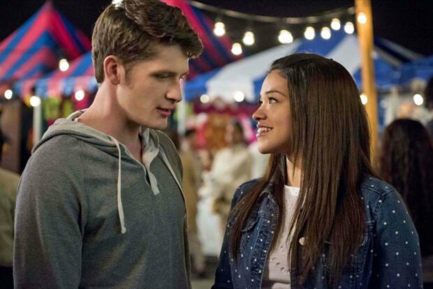 A young couple shares a romantic moment at a lively night fair in Jane The Virgin, HD Desktop Wallpaper